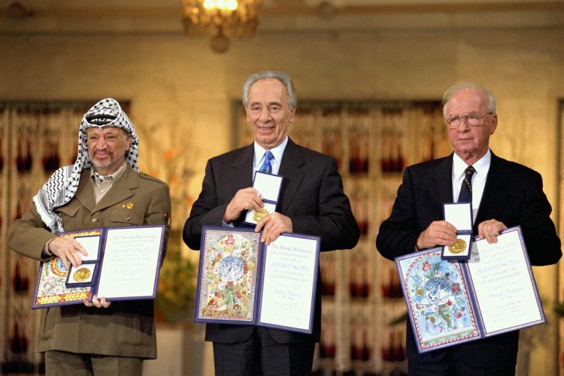 Yasser Arafat, Shimon Peres and Ytzhak Rabin receive the Nobel Peace Prize following the Oslo Accords