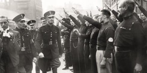 Oswald Mosley is saluted by members of his British Union of Fascists before beginning the march to Cable Street